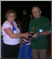 Sue Young receiving trophy for Best Male Adult