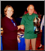 President Trevor Turner presents the Overall BIS trophy to Val Anderson